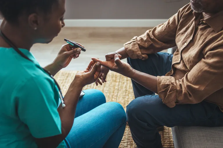 Cornerstone staff checking a patient